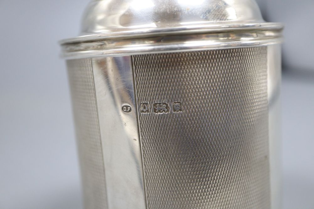 A 1920s engine turned cylindrical cigarette dispenser, London, 1929, 9.5cm, 8oz.